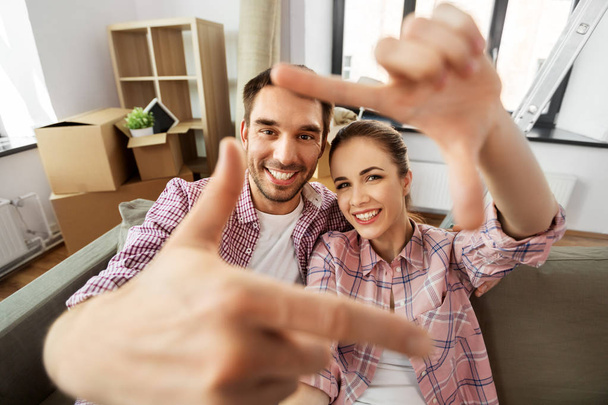 happy couple taking selfie at new home - Photo, Image