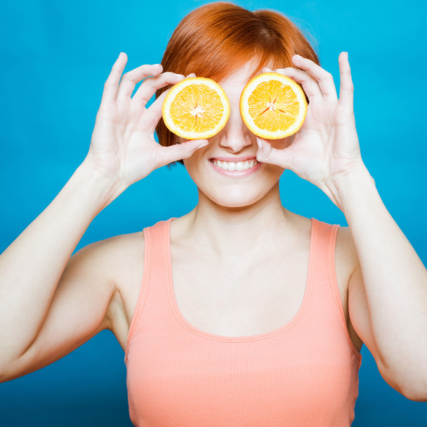 Healthy Lifestyle Woman holds orange - Фото, изображение