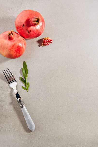 Ripe fresh pomegranate fruits and seeds with copy space - Zdjęcie, obraz