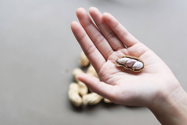 Organic peanut on the hand  - Zdjęcie, obraz