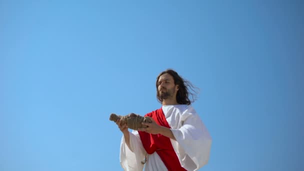 Jesus raising wine in hands to sky, blessing sacramental Eucharist beverage - Footage, Video