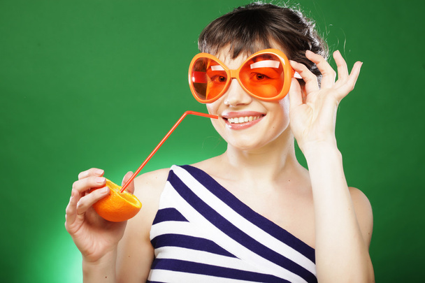 Woman with oranges - Фото, изображение