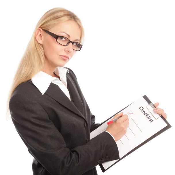 Business woman with a checklist - Foto, imagen