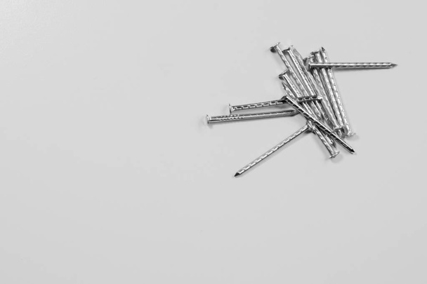 Metal nails isolated on white background. working tools - Φωτογραφία, εικόνα