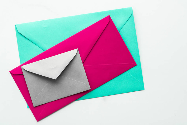 Blank paper envelopes on marble flatlay background, holiday mail - 写真・画像