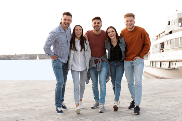 Group of happy people spending time together at promenade - Fotoğraf, Görsel