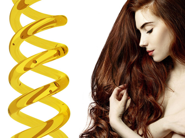 Krásná mladá žena s červenými vlasy blízko Helixu s olejem na terapii. - Fotografie, Obrázek