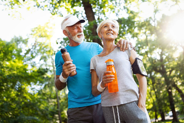 Happy senior people jogging to stay helathy and lose weight - Foto, Imagen