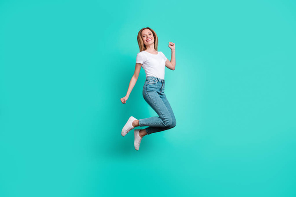 Full length photo of pretty lady jumping isolated over teal turquoise background - Fotó, kép