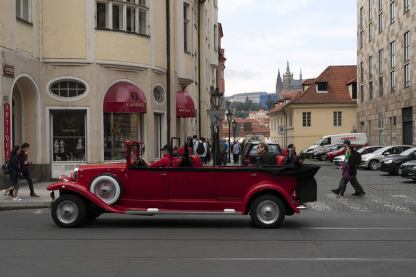PRAGUE, CZECH REPUBLIC - JULY 15 2019 - Old style cars in Town is full of tourist in summer time - Фото, изображение