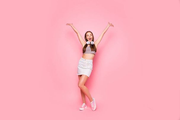 Full length photo of lovely teen screaming raising hands closing eyes isolated over pink background - Φωτογραφία, εικόνα