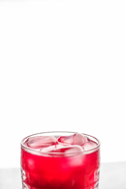 Glass of red cocktail with ice, luxury bar party - Photo, Image