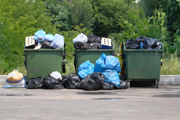 Dumpsters being full with garbage. Garbage is pile lots dump. Garbage waste lots junk dump. - Photo, Image