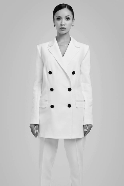 Gorgeous latin women in fashion white suit - Foto, Imagen