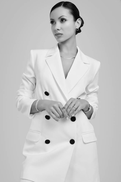 Gorgeous latin women in fashion white suit - Photo, image