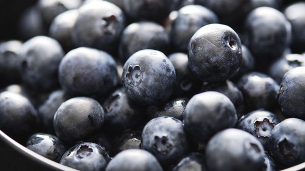 Close-up of ripe and juicy fresh picked blueberries. - 写真・画像