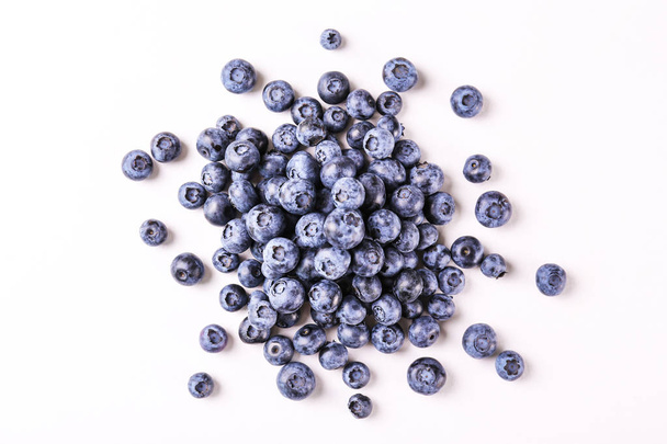 Organic blueberry berries in pile. - Zdjęcie, obraz