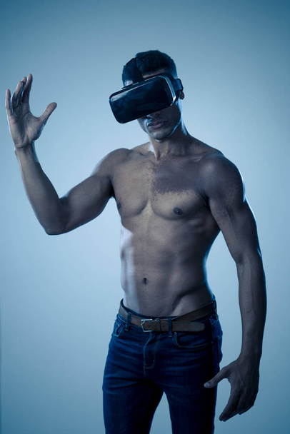 Attractive african american man using augmented VR glasses exploring 3d world feeling excited about simulation, new sensations and desires. In virtual reality, innovation and new technology concept. - Foto, immagini