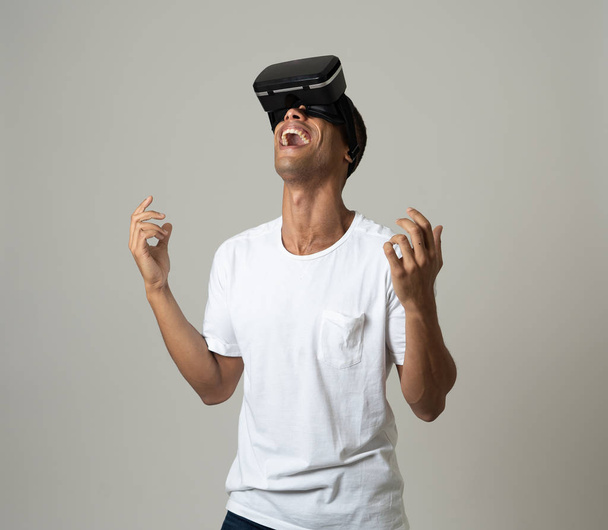 Amazed african american man using VR headset glasses, feeling excited about simulation, exploring virtual reality making gestures interacting with new virtual world. In new technology concept. - Valokuva, kuva