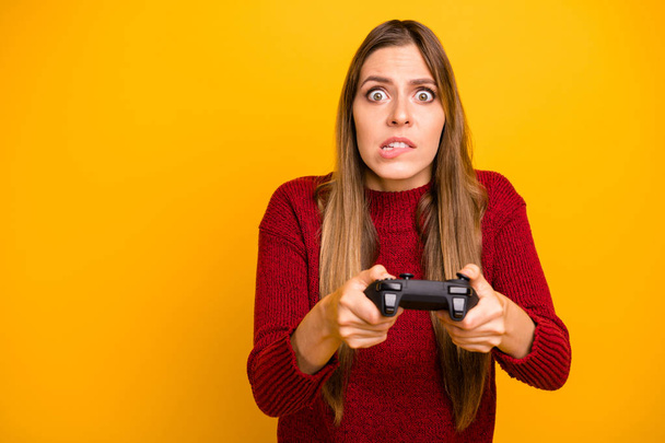 Crazy lady worried about video game match result wear knitted pullover isolated yellow background - Photo, image
