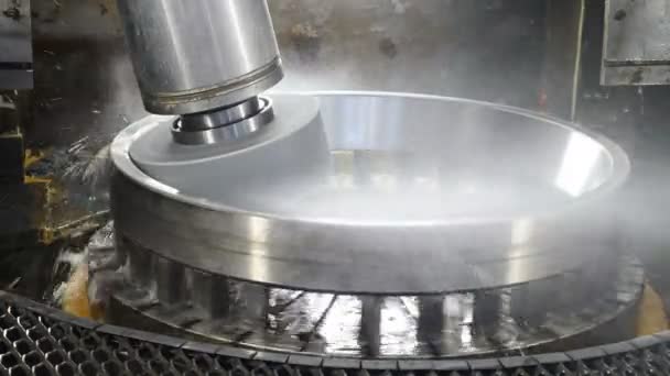 Industry concept. Grinding wheel disk polishing metal surface on bearings manufacture. Rolling mill machine with cooling water splashing. Technological part of fully automatical bearing assembling - Footage, Video