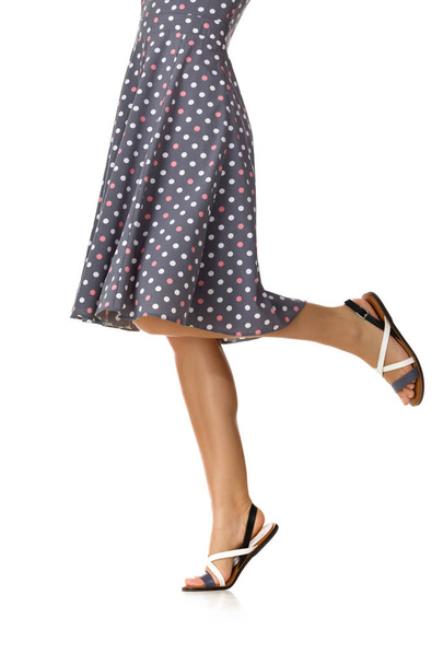 Woman in polka-dot dress standing in shoes - Foto, imagen