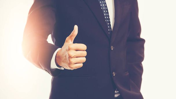 Businessman showing thumbs up - 写真・画像