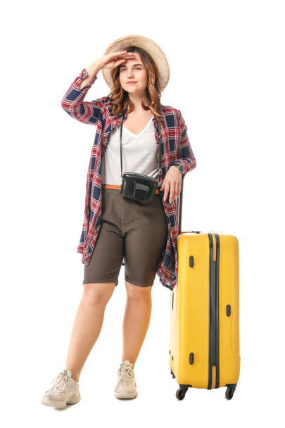 Turista femenina con equipaje sobre fondo blanco - Foto, Imagen
