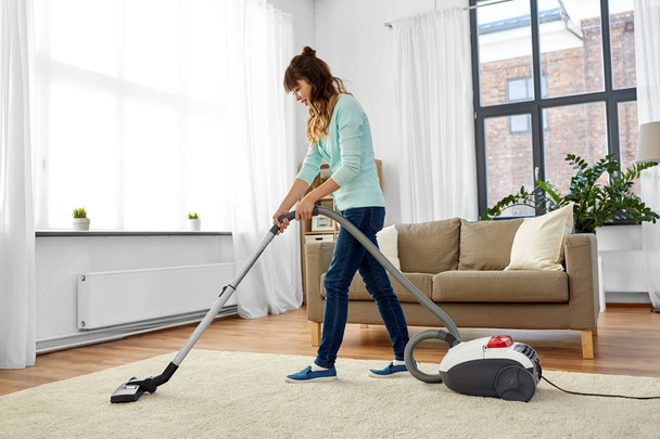 asian woman with vacuum cleaner at home - Photo, image
