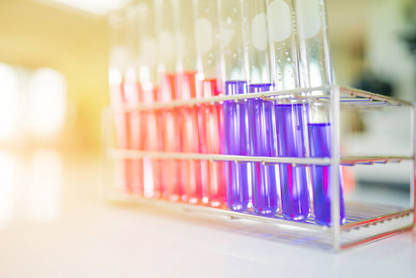 Close-up of colorful chemical test tubes on  tray in medical lab - Photo, Image