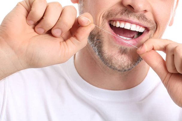 Man flossing teeth, closeup - Photo, Image