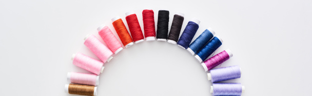 panoramic shot of bright and colorful threads on white background  - Photo, Image