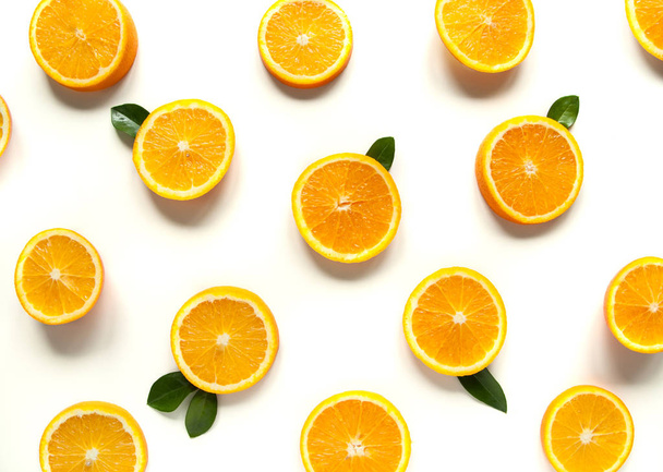 Round orange slices on a white background.Citrus tropical fruit background. Bright food. Dietary vitamin nutrition. A lot of vitamin C. - Foto, Bild