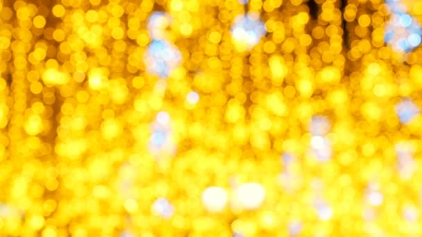 Bright Christmas Street Illumination. The City is Decorated for the Christmastide Holiday. New Year Lights Decorating Shimmering bokeh. Bright festive Christmas abstract background of twinkling - Footage, Video