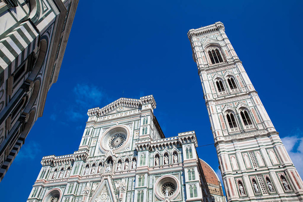 Baptistery of St. John, Giotto Campanile and Florence Cathedral consecrated in 1436 against a beautiful blue sky - Photo, Image
