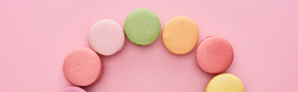 frame of delicious French macaroons on pink background, panoramic shot - Photo, Image