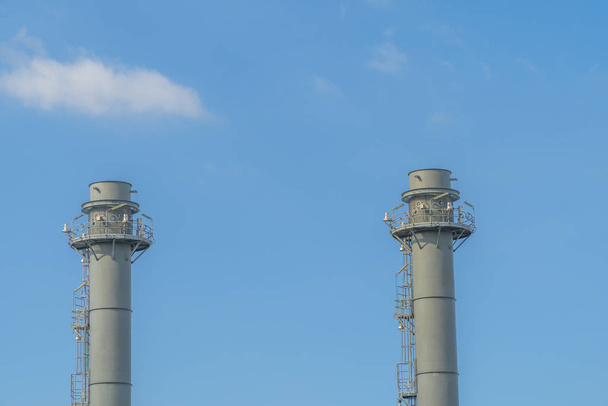 Industrial chimney of power plant and oil refinery - Foto, immagini