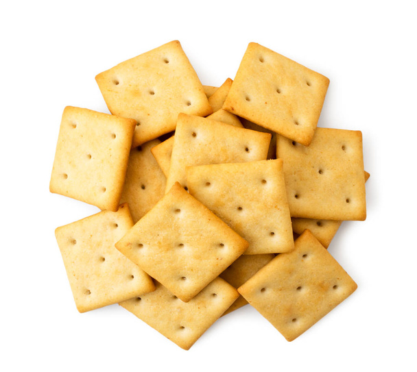 Pile of crackers on a white background. The view of the top. - Fotoğraf, Görsel