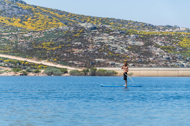 Stand up paddle on a lake - Фото, изображение