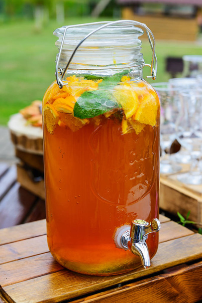 Kombucha tea with oranges and mint in a jar. - Photo, Image