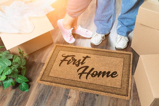 Man and Woman Unpacking Near First Home Welcome Mat, Moving Boxes and Plant - Photo, Image
