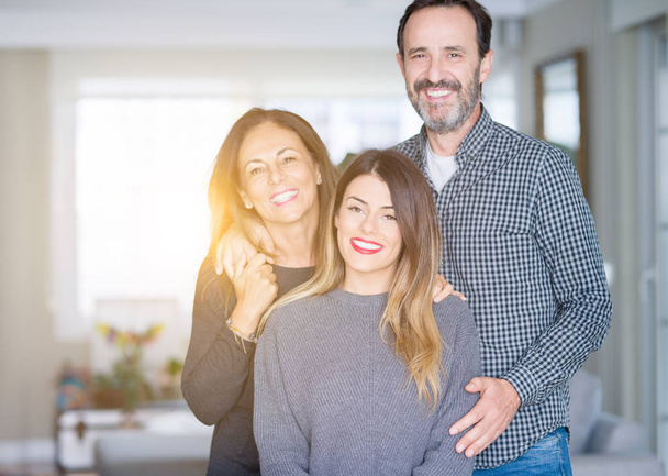Beautiful family together. Mother, father and daughter smiling a - Photo, Image
