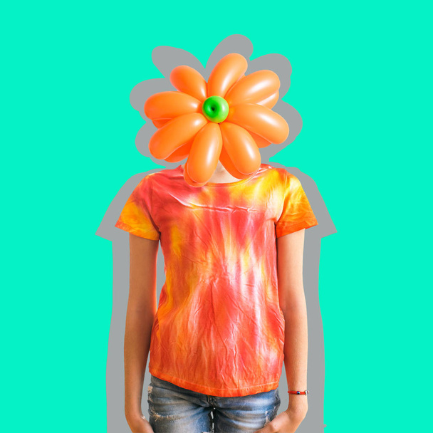 Flower of balloons on the head of a child dressed in the style of tie dye. Contemporary art collage. - Photo, Image