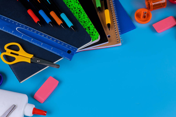 Back to school. School supplies on blue background - Foto, immagini