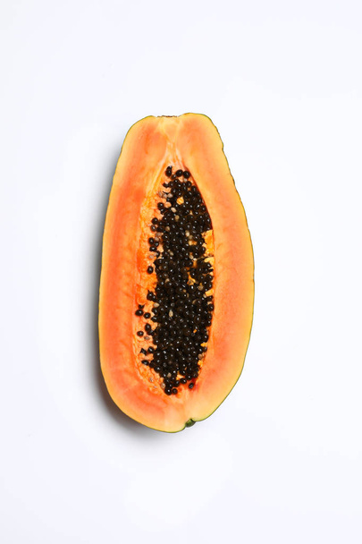 Fresh juicy halved papaya on white background, top view - Фото, изображение