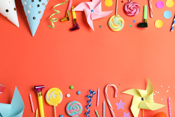 Flat lay composition with different birthday party items on coral background, space for text - Photo, image