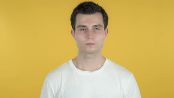 Rejecting Young Man Disliking Offer Isolated on Yellow Background - Záběry, video