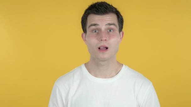 Young Man Gesturing Failure and Problems Isolated on Yellow Background - Filmati, video