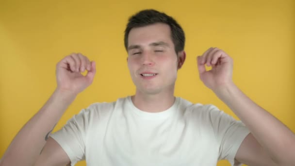 Happy Young Man Dancing Isolated on Yellow Background - Imágenes, Vídeo
