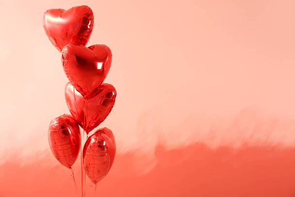 Heart-shaped air balloons on color background - Fotó, kép